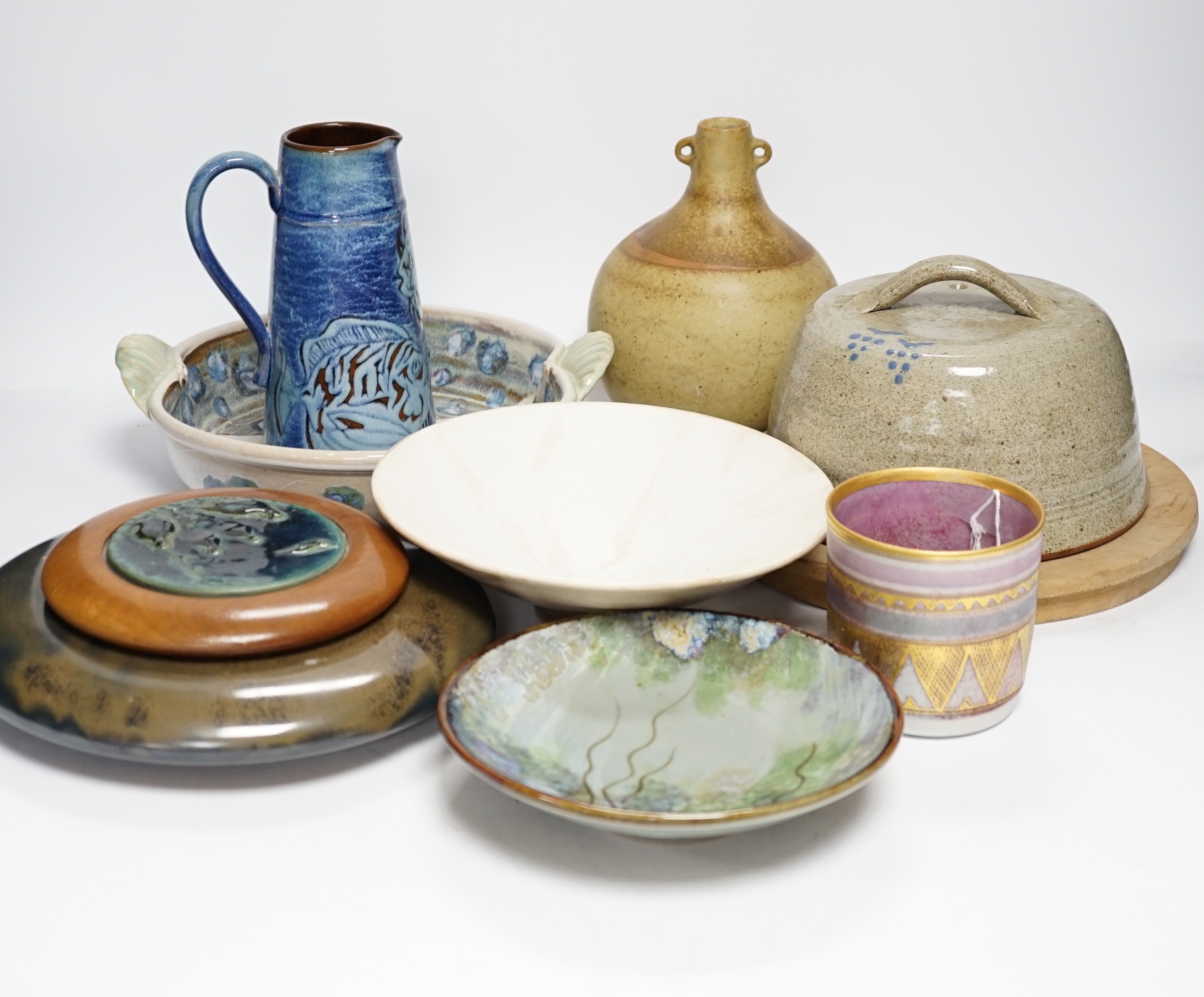 Eight studio pottery items including a cylindrical pot by Mary Rich, a Brenda Wright serving dish, a Tony Gant vase, etc.
